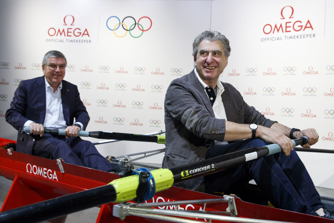 IOC President Thomas Bach and Nick Hayek, CEO of Swatch Group showing their strength at The Olympic Museum in Lausanne